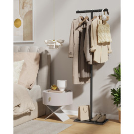 T veida brīvi stāvošs drēbju statīvs.